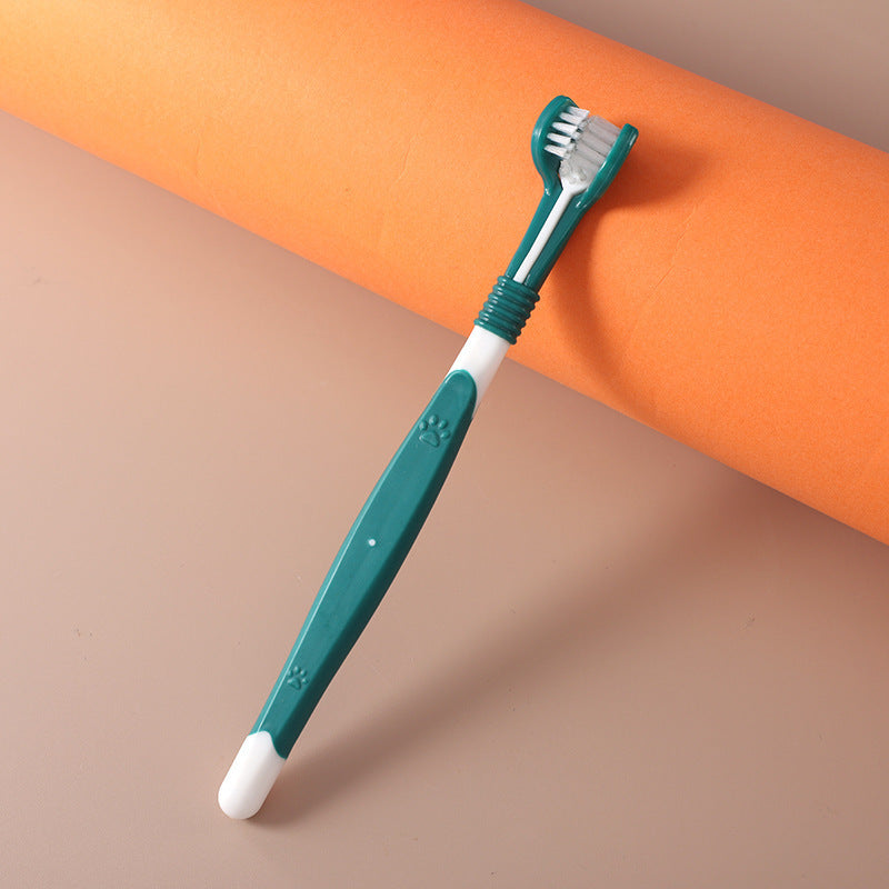 Green pet toothbrush with paw design – dental care brush for dogs and cats.
