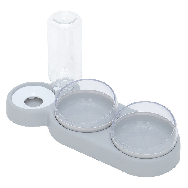 A set of pet bowls in various shades of green, with one featuring an automatic water dispenser on top.