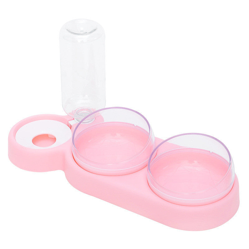 A set of pet bowls in various shades of green, with one featuring an automatic water dispenser on top.