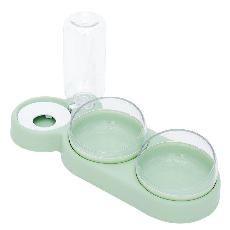 A set of pet bowls in various shades of green, with one featuring an automatic water dispenser on top.