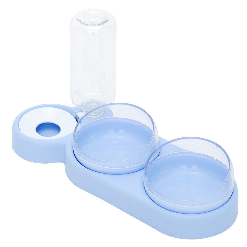 A set of pet bowls in various shades of green, with one featuring an automatic water dispenser on top.