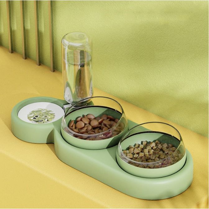 A set of pet bowls in various shades of green, with one featuring an automatic water dispenser on top.