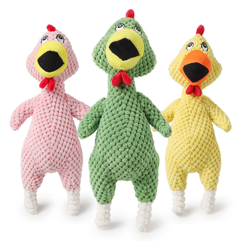 Three colorful knitted chicken toys in pink, green, and yellow on a white background.