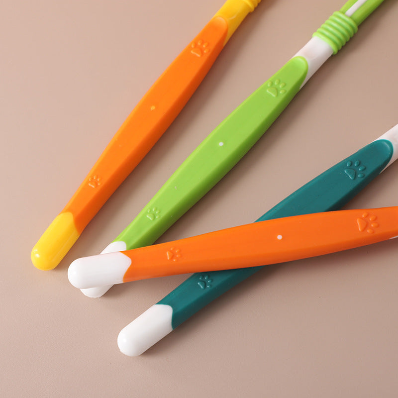 Colorful pet toothbrush handles with paw design – green, blue, orange, and yellow dental care brushes for dogs and cats.
