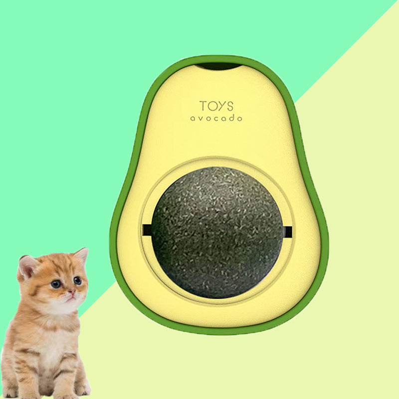 Interactive cat toy designed as a green avocado with a black and green catnip ball in the center, with a small orange kitten beside it.