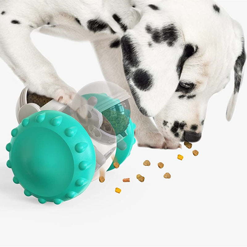 Dog playing with interactive treat dispenser toy – smart rolling tumbler for cats that releases food when pushed, promotes exercise and mental stimulation