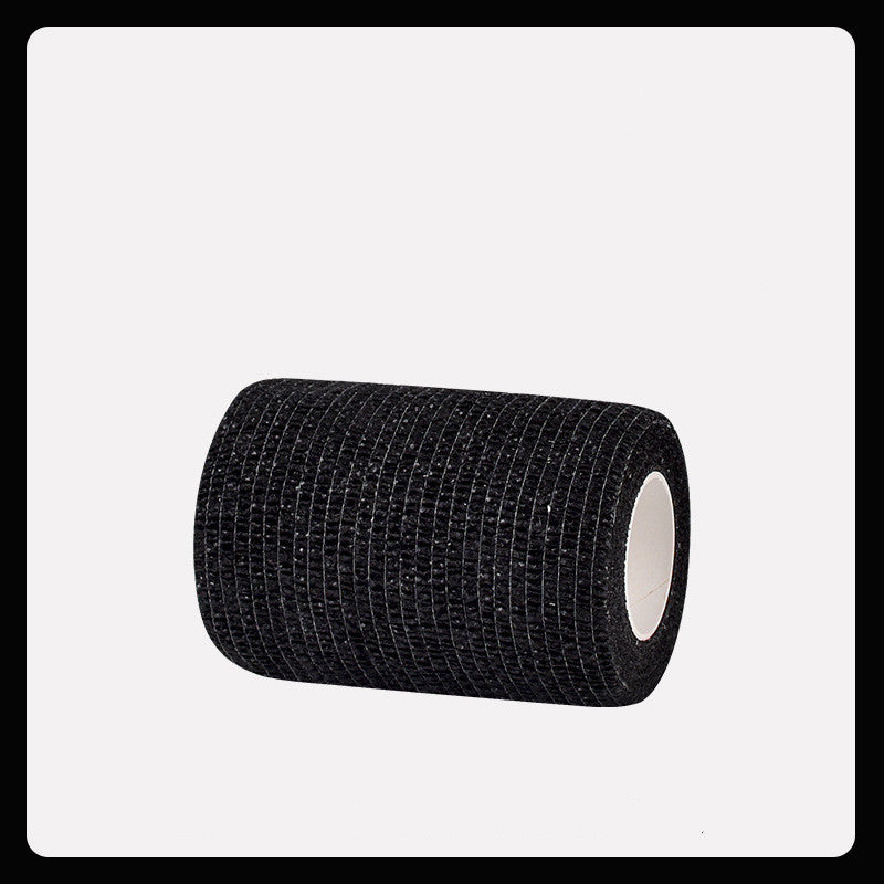 Roll of black elastic bandage on a white background