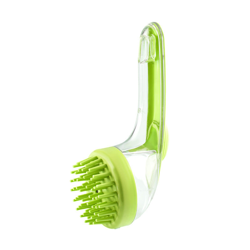 Green kitchen brush with clear handle on a white background