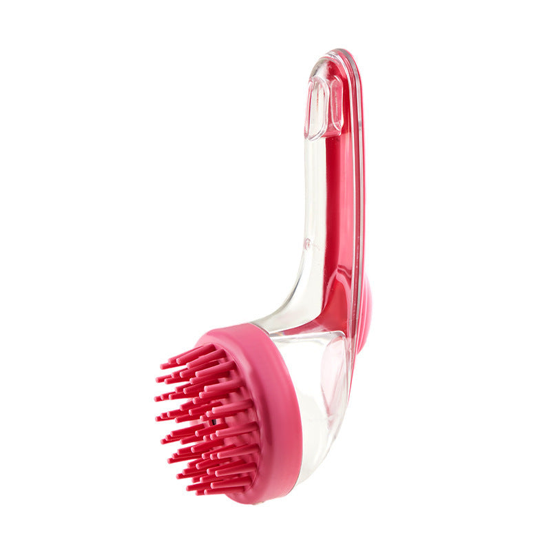 Pink and clear kitchen brush on a white background