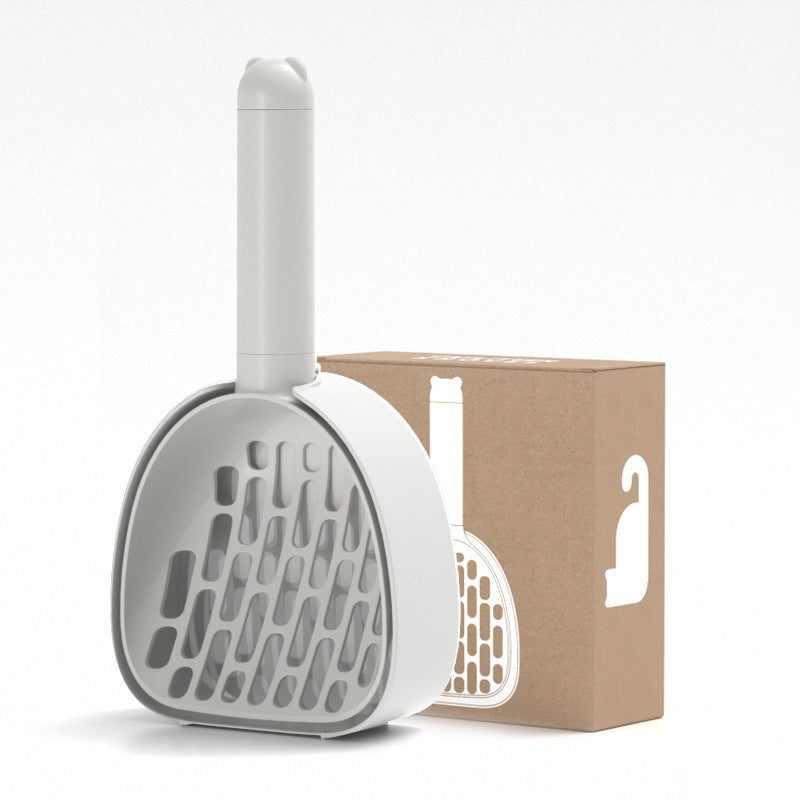 Grey cat litter scoop with slotted design shown with packaging box, ABS plastic durable cleaning tool for cat litter box