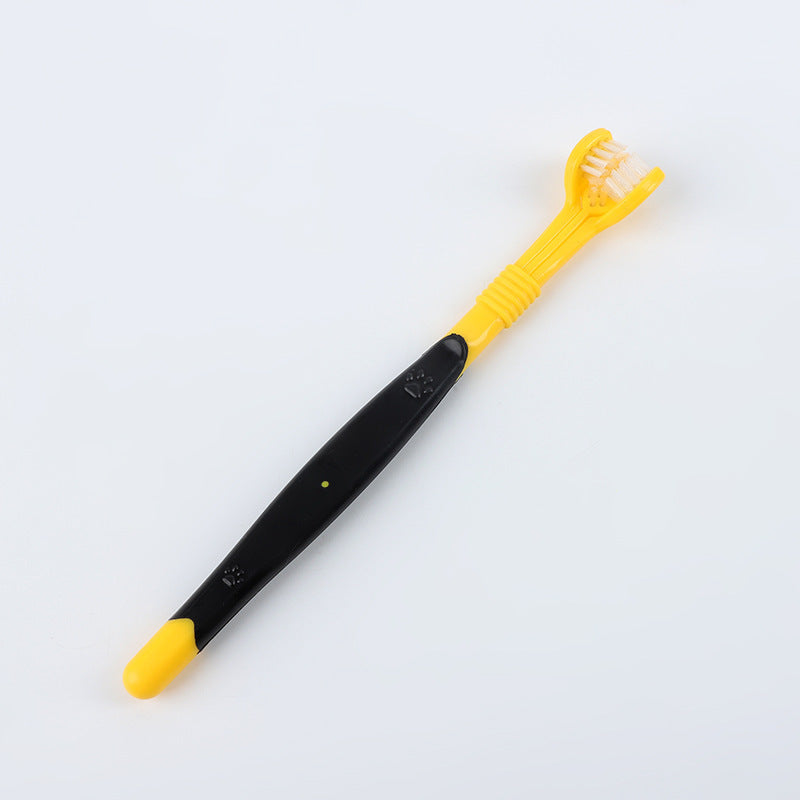 Yellow and black pet toothbrush with paw design – dental care brush for dogs and cats.