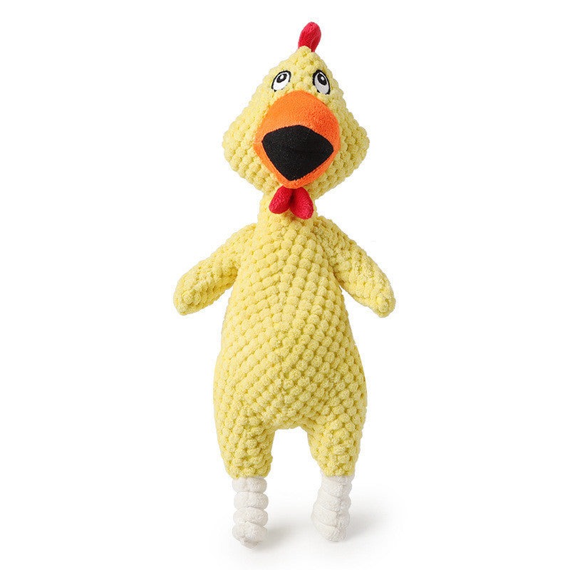 Yellow knitted chicken toy with a red bow tie on a white background