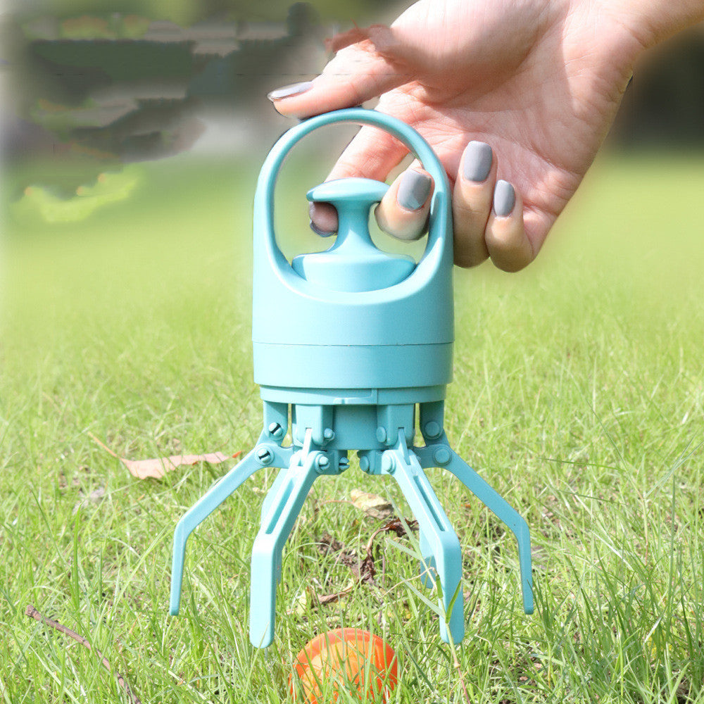 Portable dog pooper scooper with 8-claw design picking up waste on grass, hygienic outdoor pet cleanup