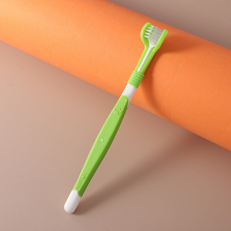 Green pet toothbrush with paw design – dental care brush for dogs and cats.
