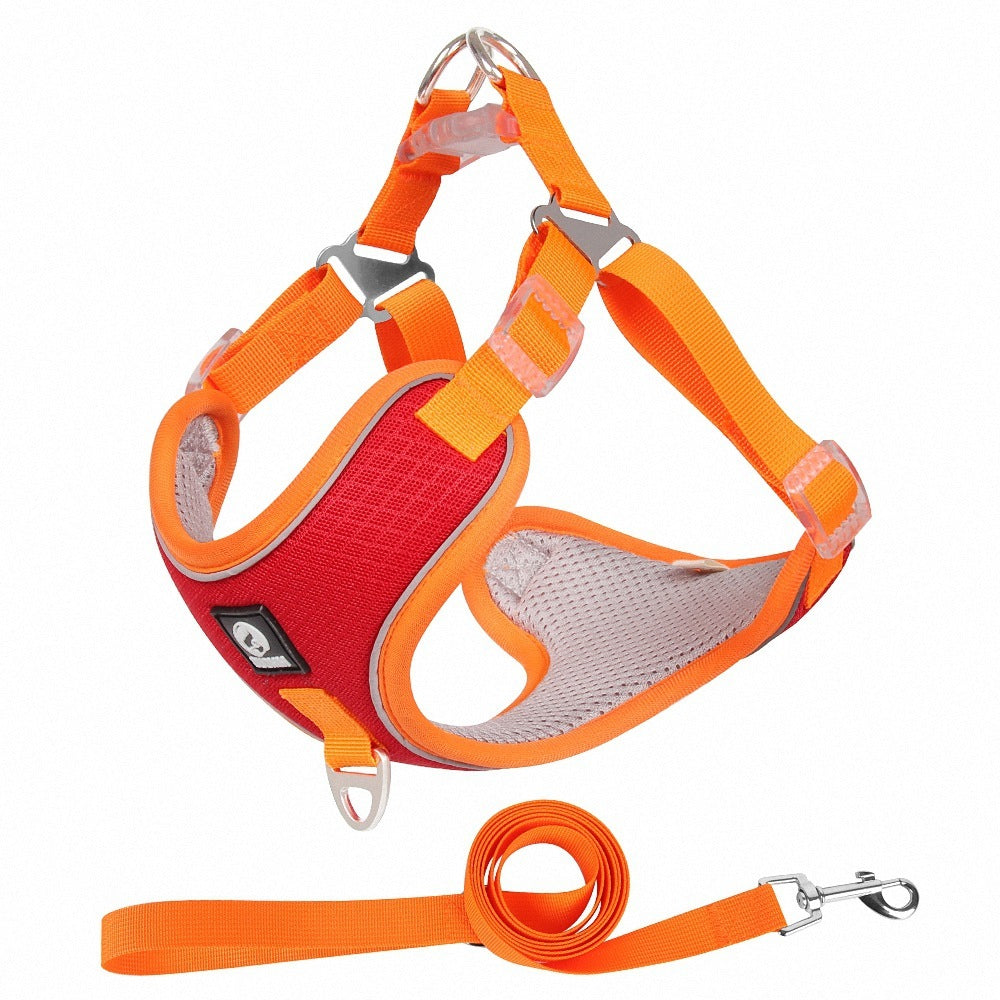 Adjustable orange no-pull dog harness with matching leash made of breathable mesh — reflective, comfortable, and secure for daily walks.