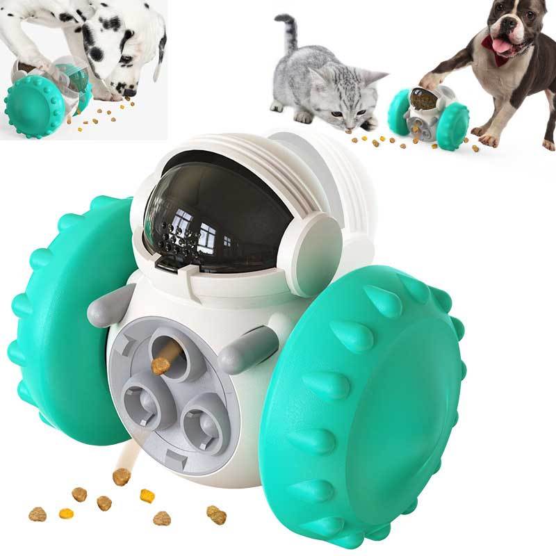 Interactive treat dispenser toy designed like a robot with small treat holes on its surface, being used by a dog and a cat in separate images, indicating slow feeding and playtime enrichment.