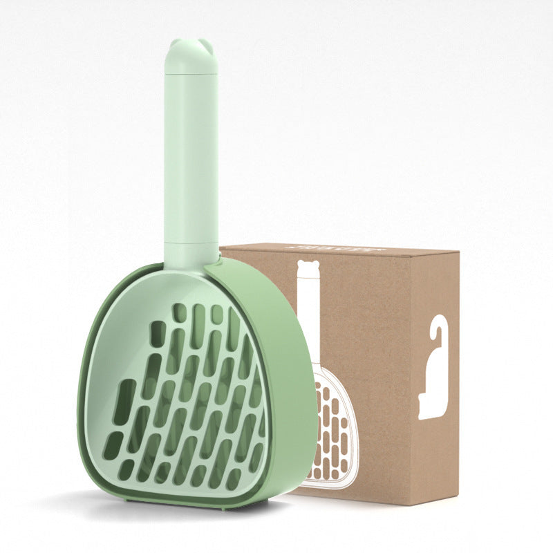 Green cat litter scoop with modern slotted design shown with packaging box, durable ABS plastic pet cleaning tool