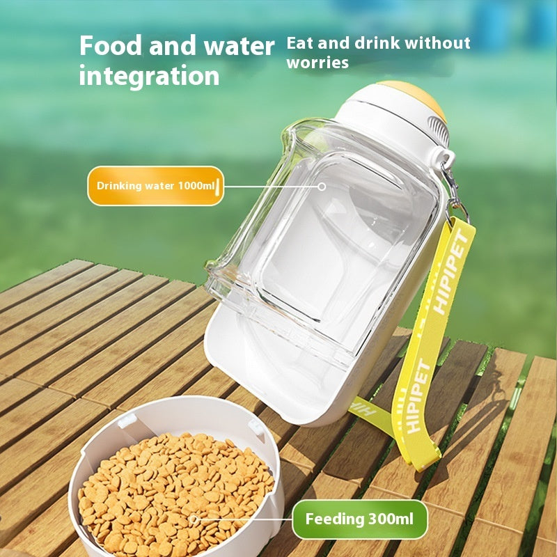 Pet food and water container with a bowl of food on a wooden surface, labeled for water and food capacity.