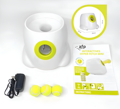 Pet toy with packaging, power adapter, and tennis balls on a white background