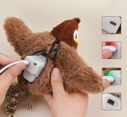 Plush toy with a white device attached, held by a hand on a beige background.
