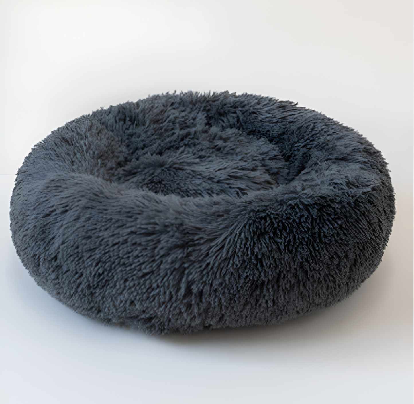 Fluffy gray pet bed on a white background