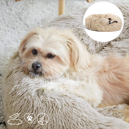 Dog lying on a fluffy pet bed with an inset showing a close-up of the product.